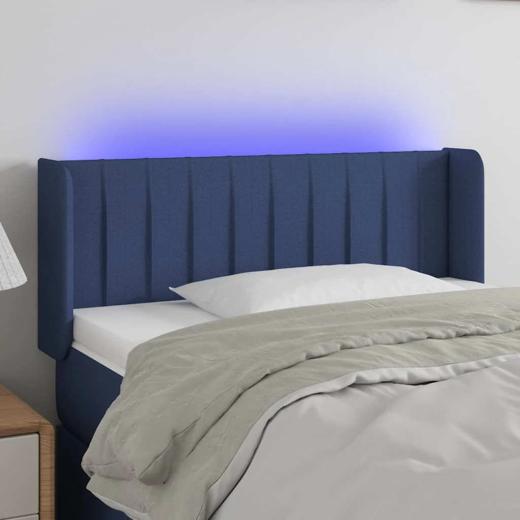 sengegavl med LED-lys 83x16x78/88 cm stof blå