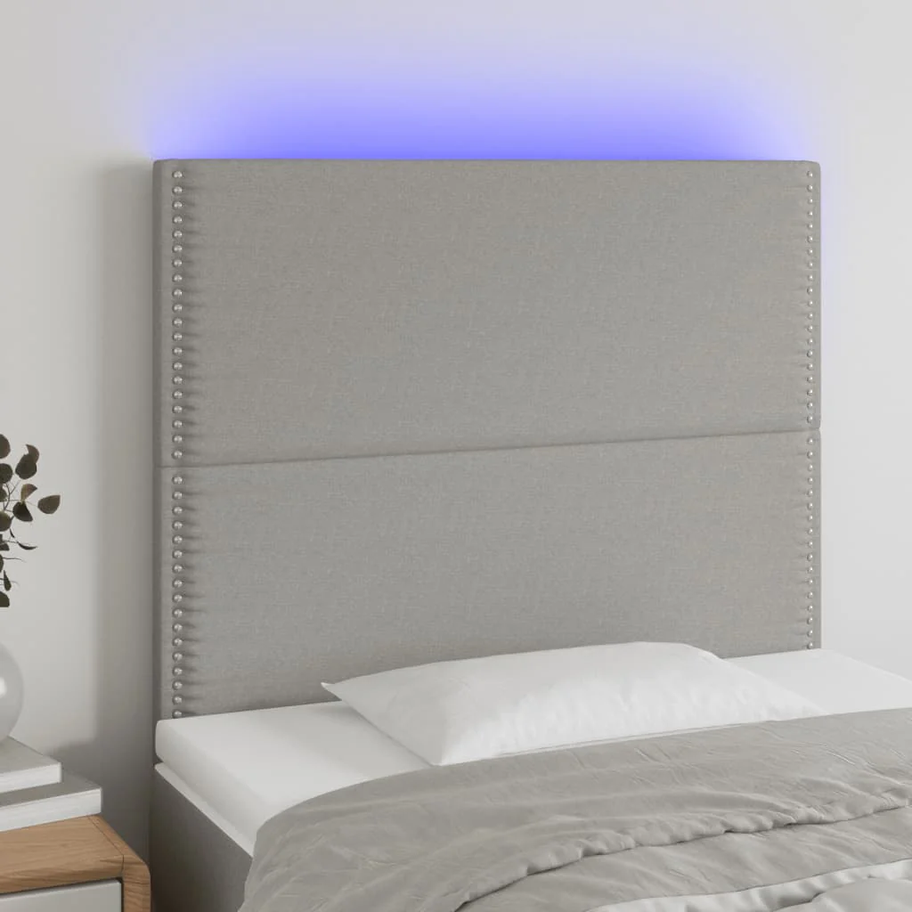 sengegavl med LED-lys 90x5x118/128 cm stof lysegrå